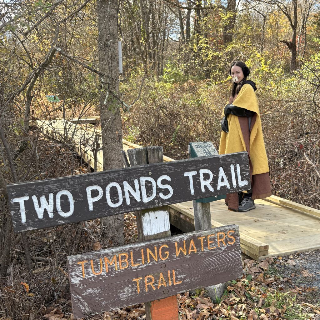 Someone in a beaver costume at the trailhead for the Two Ponds Trail.